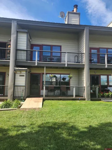 a swimming pool with outdoor seating