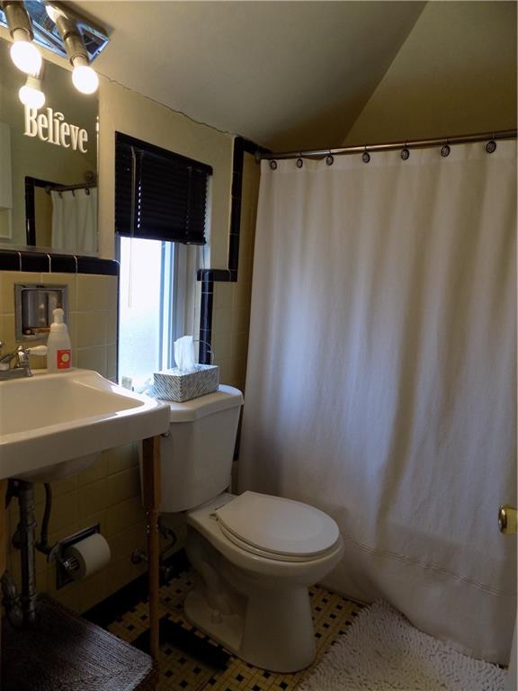 2011 Brookfield Road Pittsburgh, PA 15243 - Photo 12 of 17 a bathroom with a toilet a sink and a mirror