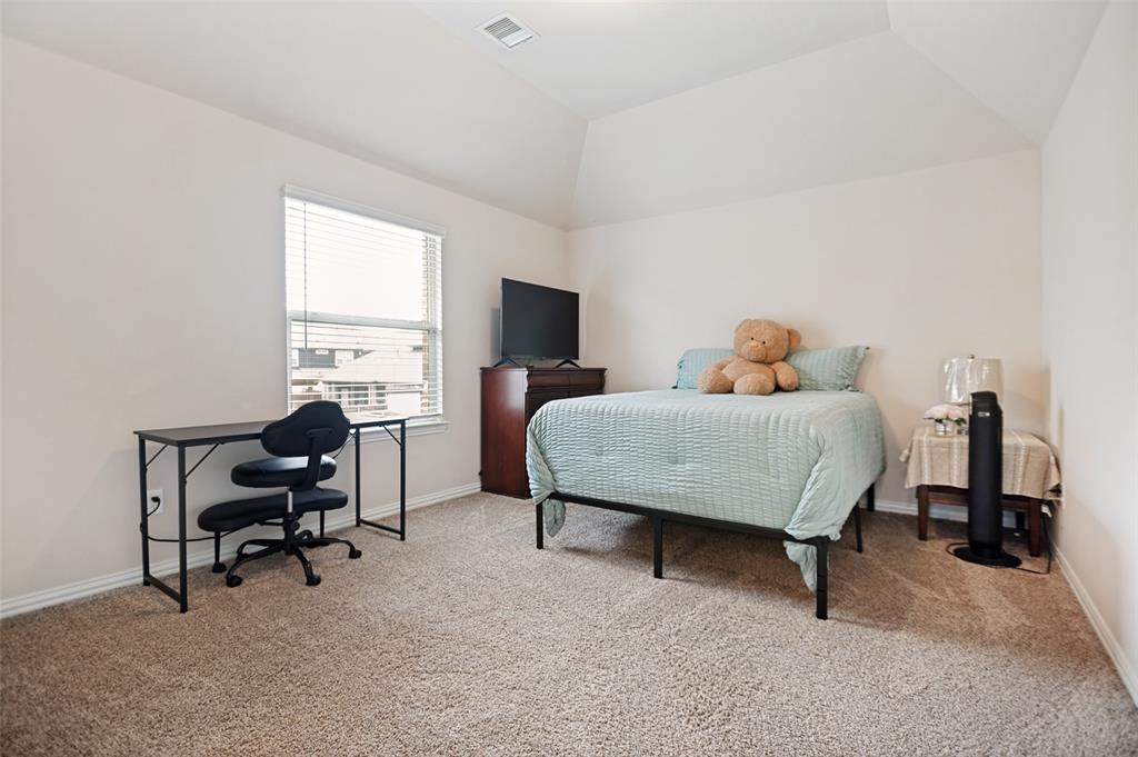 413 Frontier Court Midlothian, TX 76065 - Photo 20 of 26 Carpeted bedroom featuring a vaulted ceiling and a single window with blinds