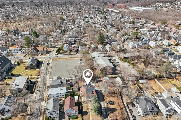 an aerial view of residential house with parking space