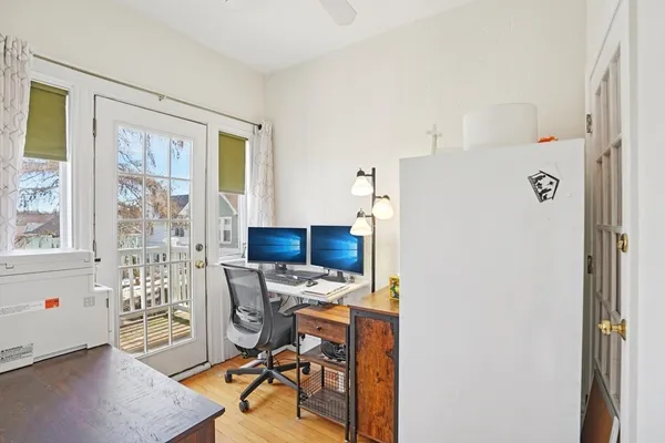 a living room with sink and a wooden floor