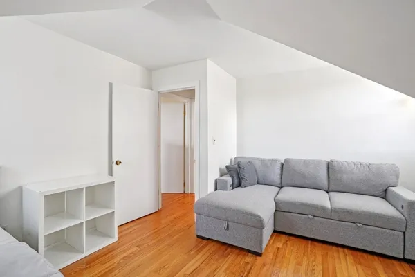 a view of a house with a yard covered in snow