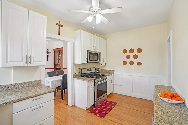 a view of a dining room with furniture and window