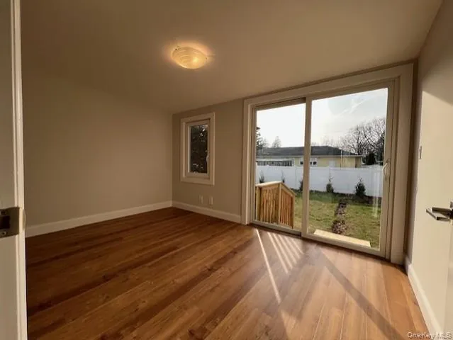 a view of a room with wooden floor and stairs