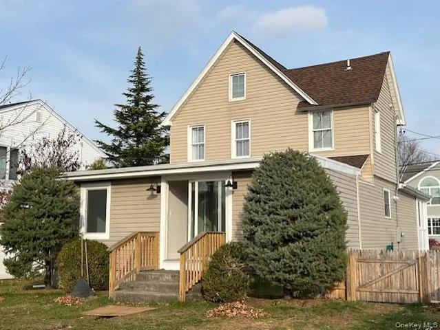a view of a house with a yard