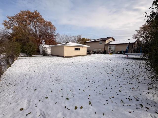 a view of a storage room with a table and chairs