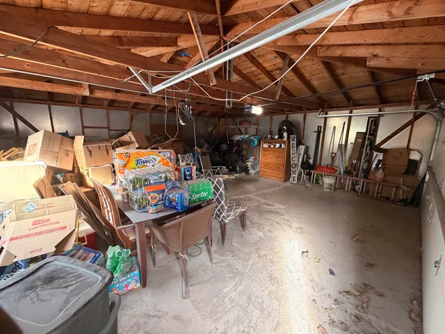 a view of a patio with table and chairs and couches