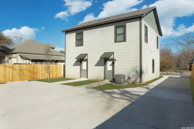 a bathroom with a sink mirror vanity and toilet