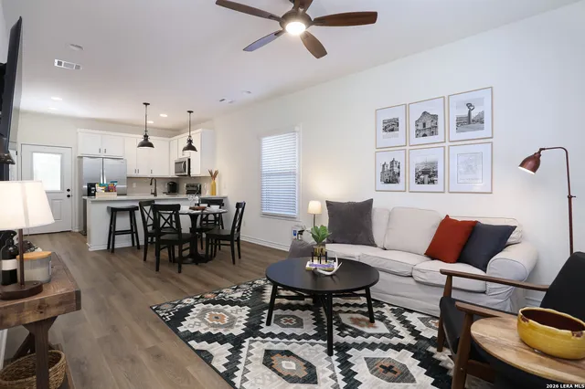 a bedroom with a bed next to a window