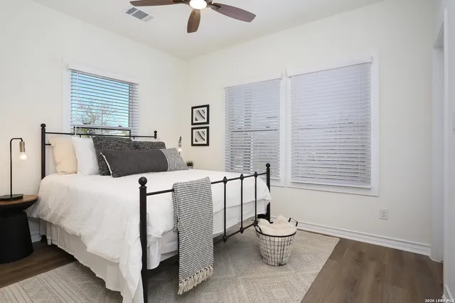 a kitchen with kitchen island a dining table and chairs