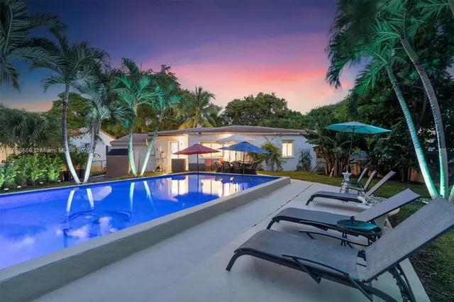 a view of a swimming pool with a patio