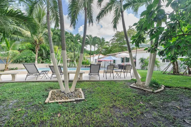 a garden view with a fountain