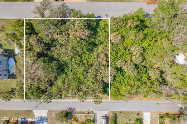 an aerial view of a house with a lake view