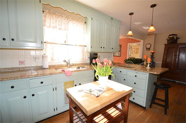 35 Olde Farms Road Boxford, MA 01921 - Photo 5 of 30 a kitchen with a table chairs and white cabinets
