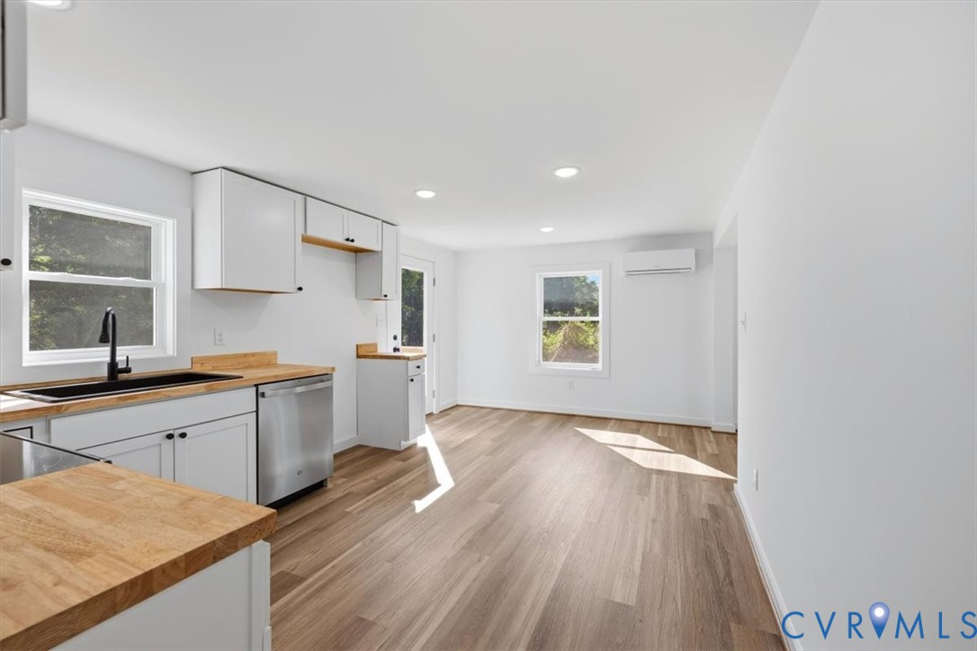 15221 Wright Road Amelia Court House, VA 23002 - Photo 11 of 22 Modern kitchen featuring wood-finish flooring, whi