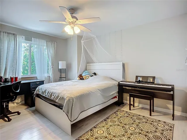 a bedroom with a bed and a table