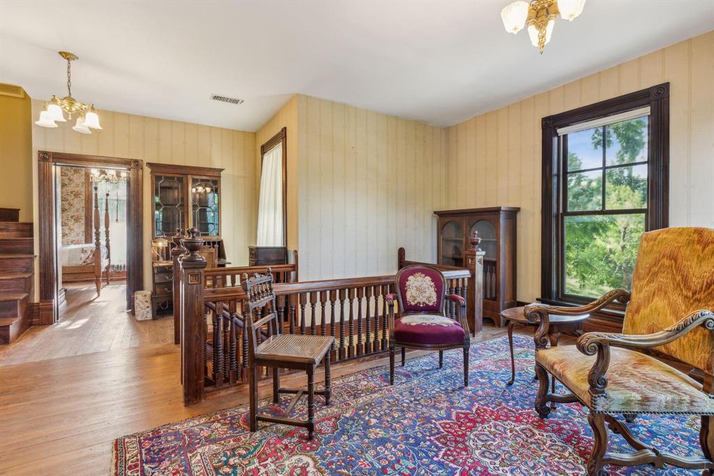 405 West Clifton Street Pilot Point, TX 76258 - Photo 15 of 33 a living room with furniture and a window