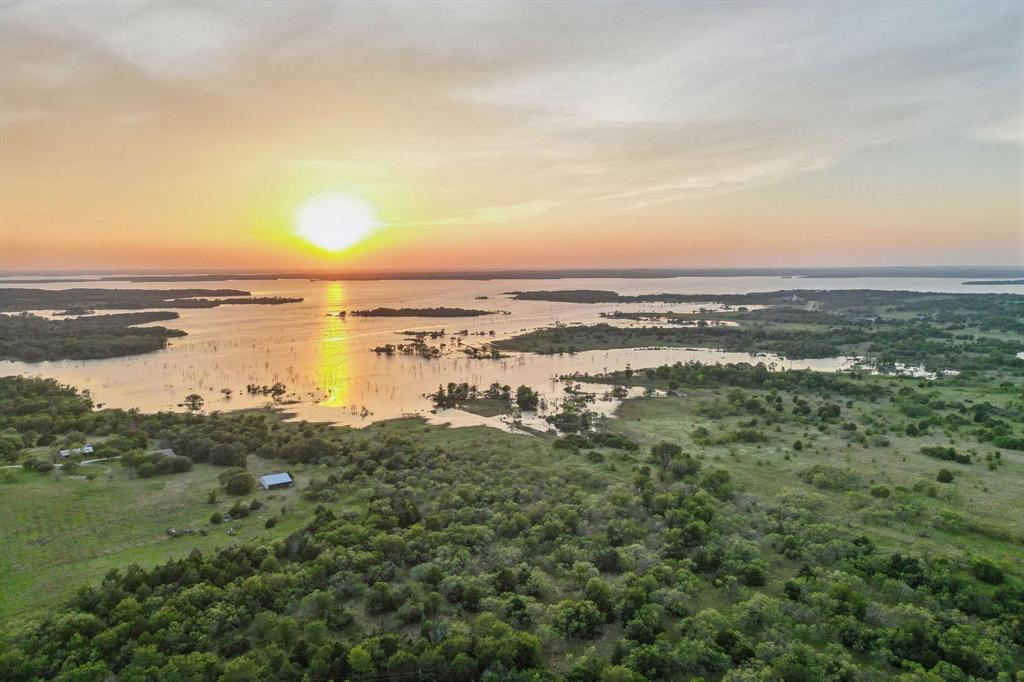 405 West Clifton Street Pilot Point, TX 76258 - Photo 29 of 33 a view of lake with ocean