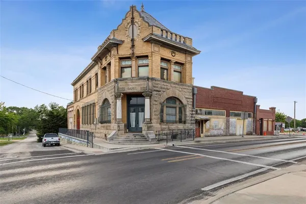 a view of a building with a street