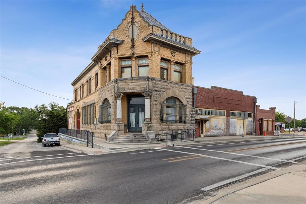 405 West Clifton Street Pilot Point, TX 76258 - Photo 31 of 33 a view of a building with a street