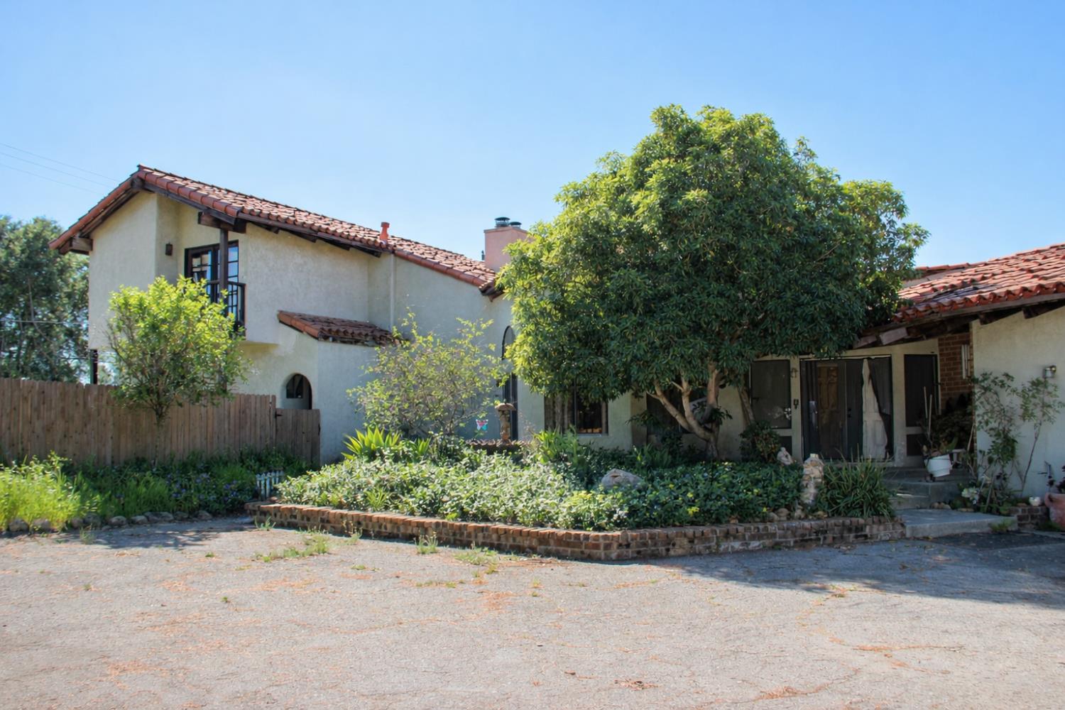 290 Encino Drive Oak View, CA 93022 - Photo 1 of 14 a front view of a house with garden