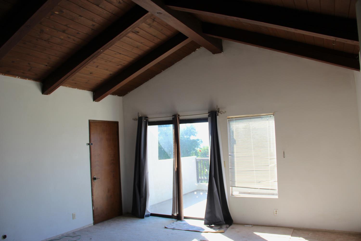 290 Encino Drive Oak View, CA 93022 - Photo 10 of 14 a view of a room with wooden floor and windows
