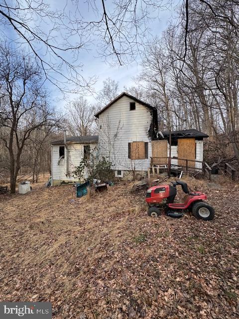 857 Ragan Road Conowingo, MD 21918 - Photo 6 of 6 a backyard of a house with fire pit and chairs