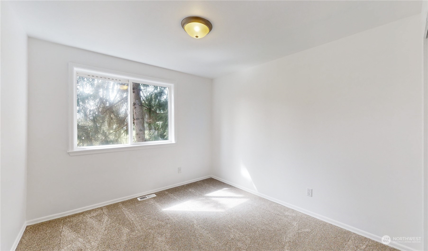 6426 Cady Road Everett, WA 98203 - Photo 17 of 39 an empty room with windows