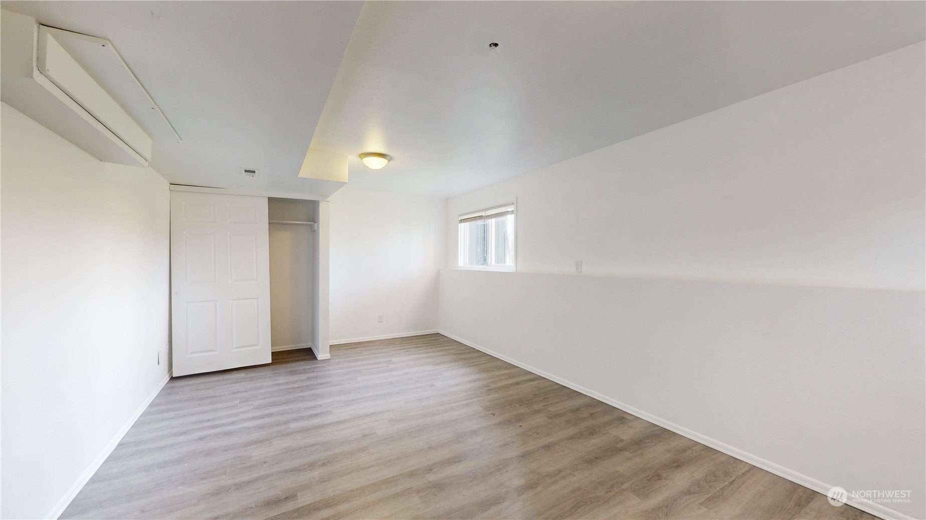 6426 Cady Road Everett, WA 98203 - Photo 20 of 39 a view of an empty room with wooden floor and a window