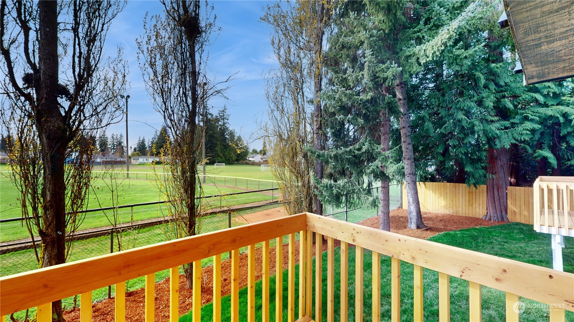 6426 Cady Road Everett, WA 98203 - Photo 22 of 39 a balcony with trees in the back yard