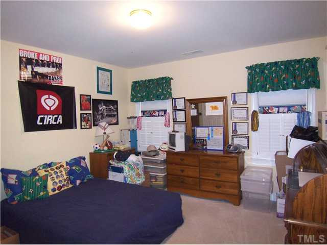 9101 Kettner Court Raleigh, NC 27615 - Photo 19 of 25 3 add'l spacious Bedrooms on this level have neutral carpet & lg closets and they share the lg hall Bath. This is Bedroom 2 which has private access to this Bath. Bedroom