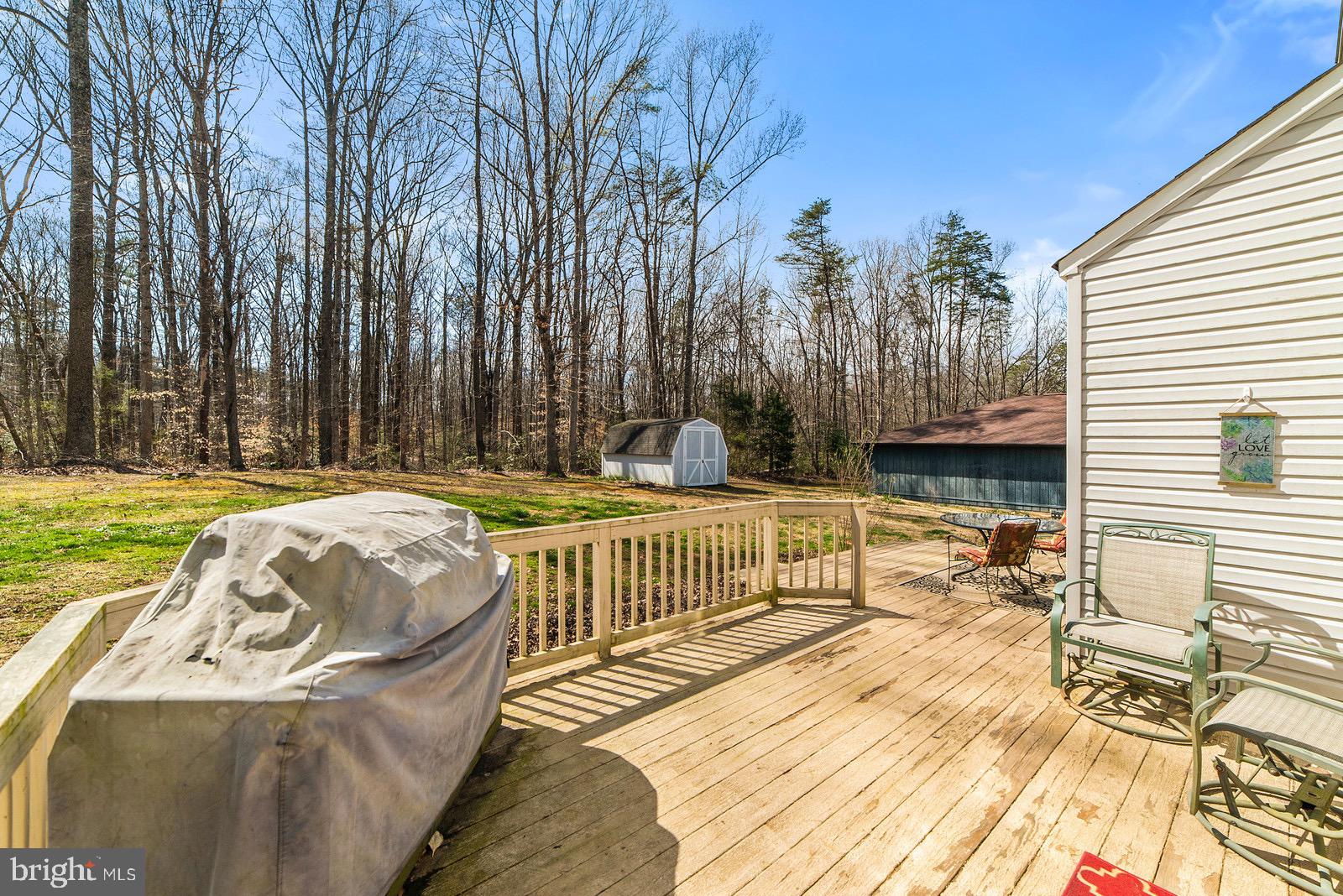 67 Ash Road Louisa, VA 23093 - Photo 34 of 66 Deck looking down at patio area