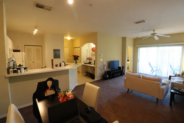 a living room with furniture and a large window