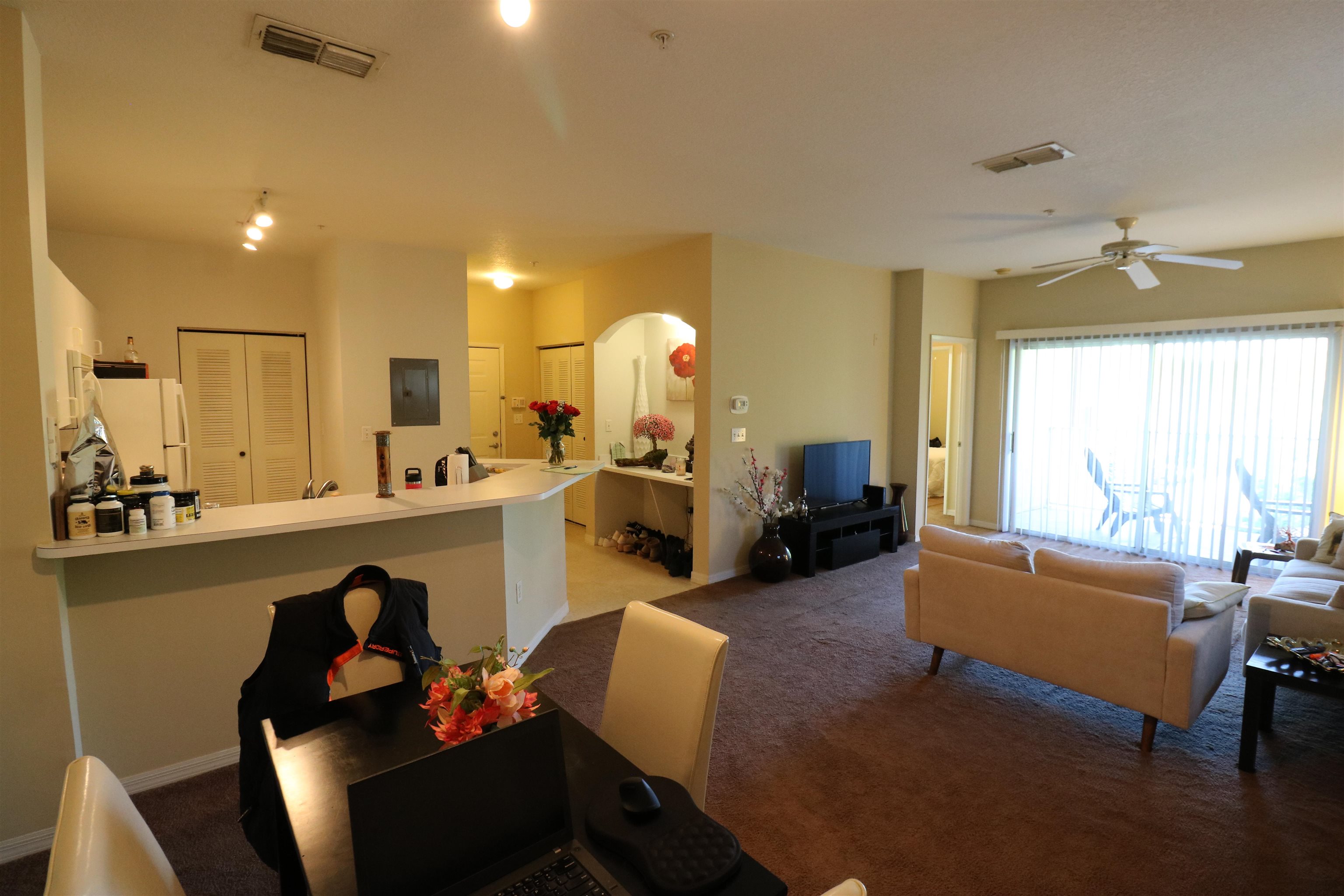 a living room with furniture and a large window