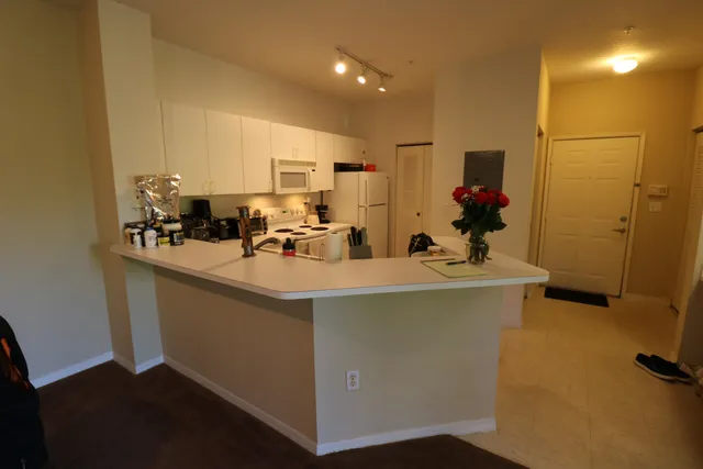 a room with sink washer and dryer