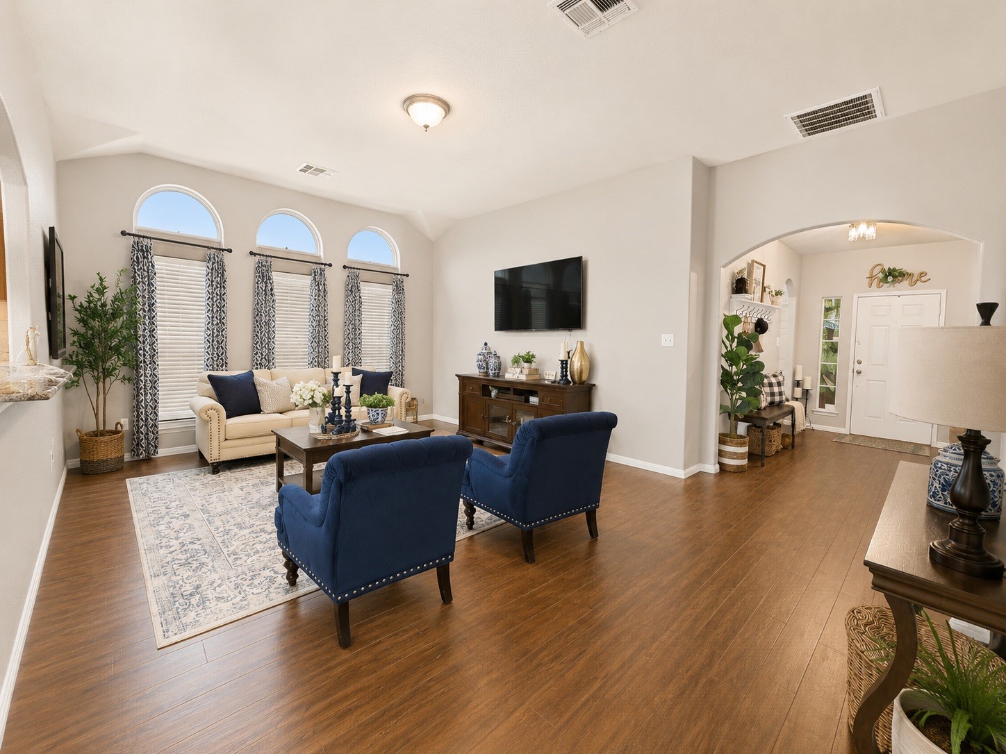9911 Bronze Mill Lane Rosharon, TX 77583 - Photo 5 of 15 From this angle, the open-concept design shines, offering effortless flow between the main living spaces.