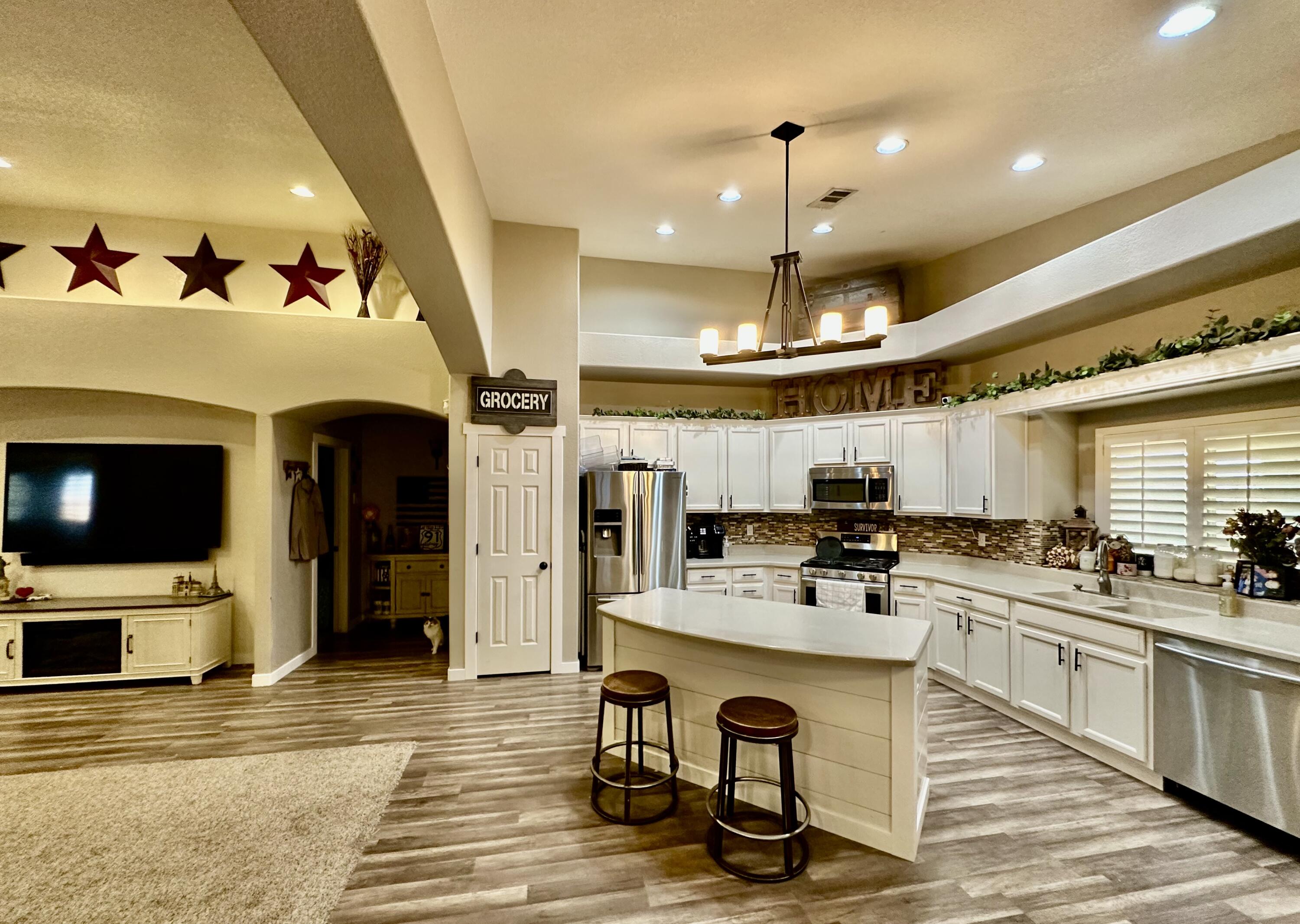 1461 Mesquite Road Blythe, CA 92225 - Photo 13 of 30 a kitchen with stainless steel appliances kitchen island granite countertop a stove and a sink