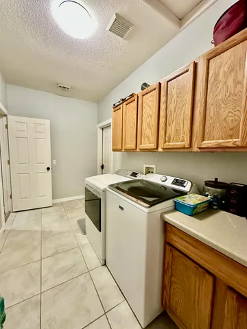 a bathroom with a toilet and a rug