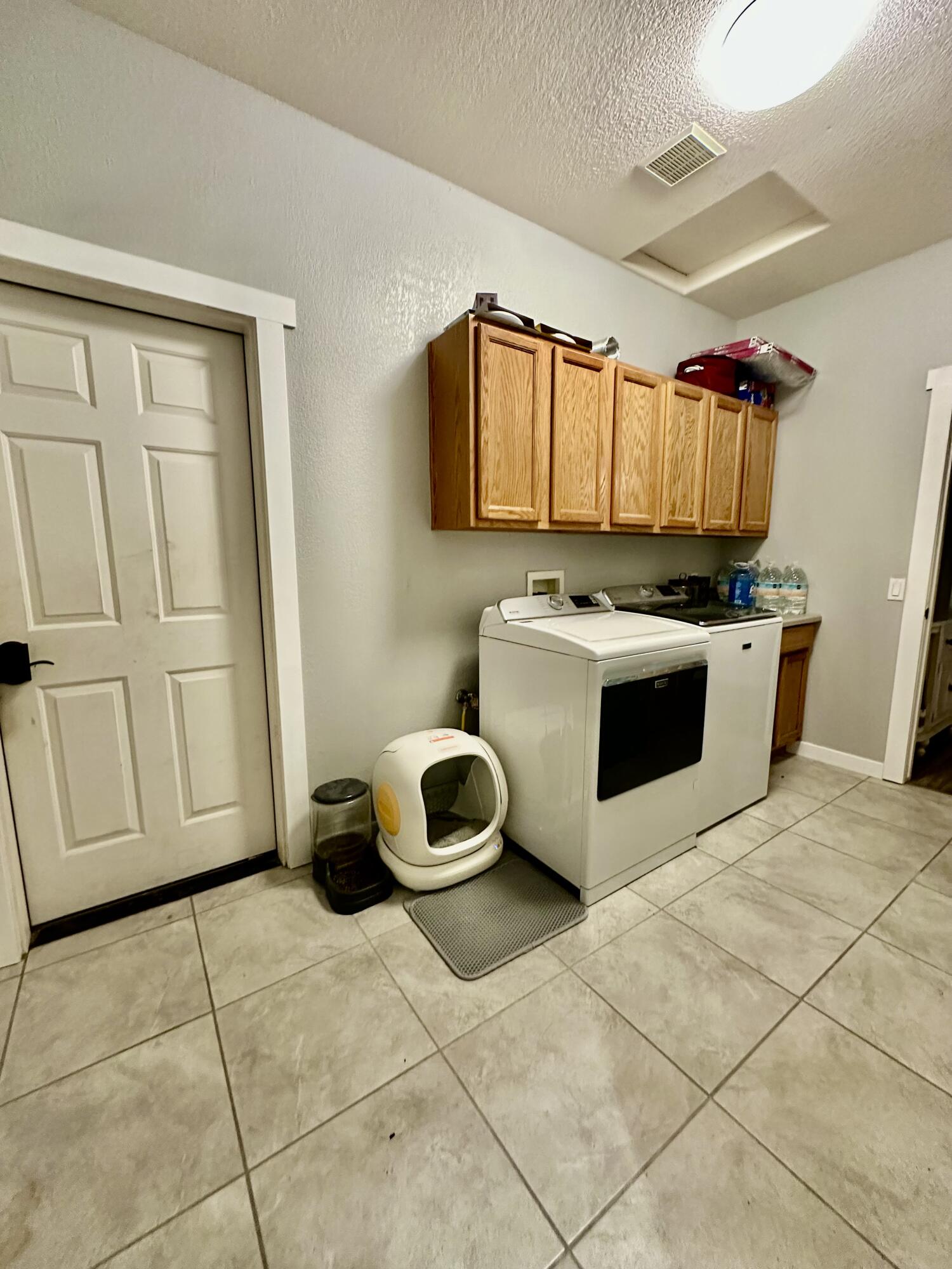 1461 Mesquite Road Blythe, CA 92225 - Photo 15 of 30 a kitchen with a stove a sink and a refrigerator