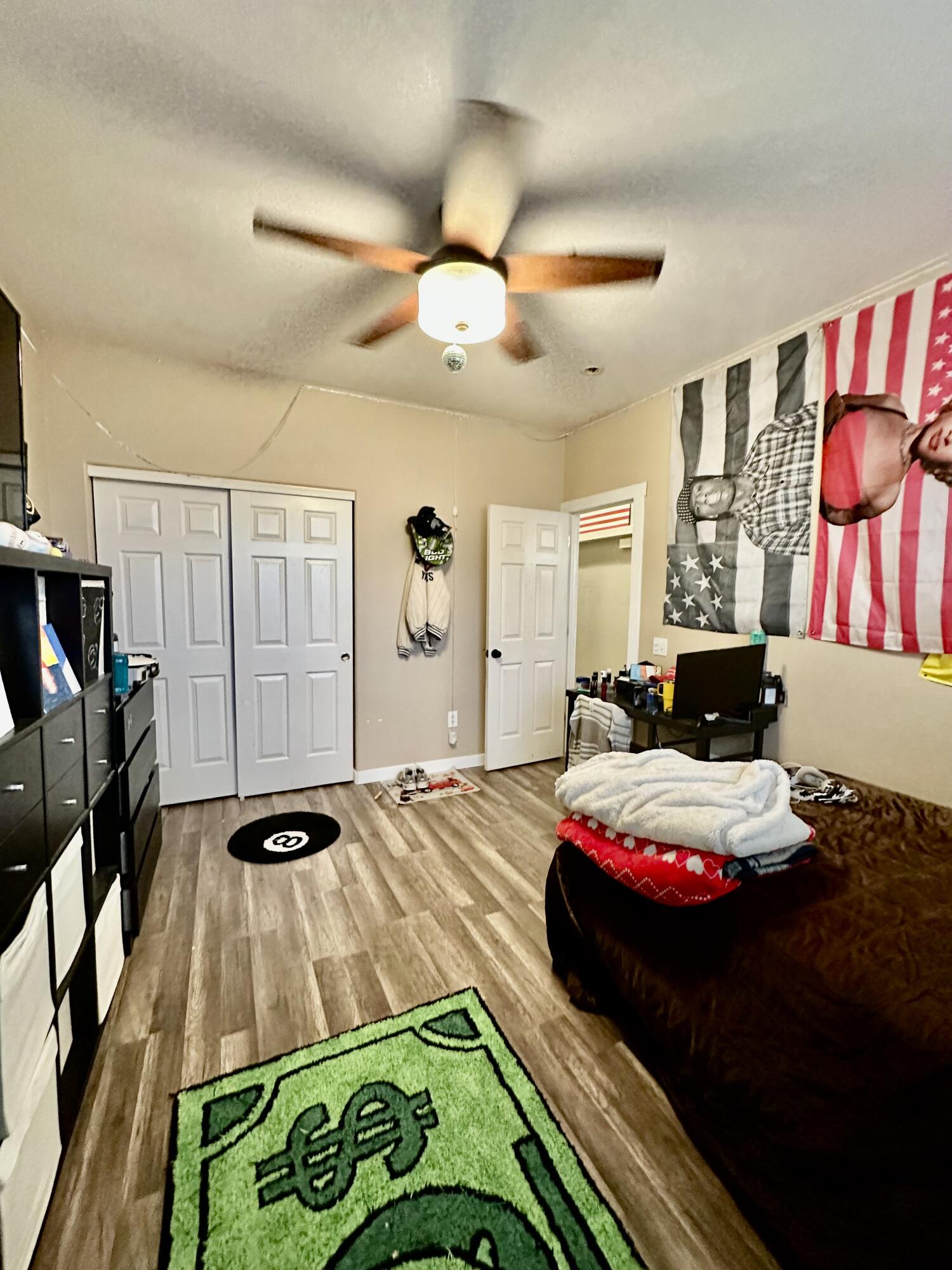 1461 Mesquite Road Blythe, CA 92225 - Photo 21 of 30 a bedroom with a bed and a chandelier