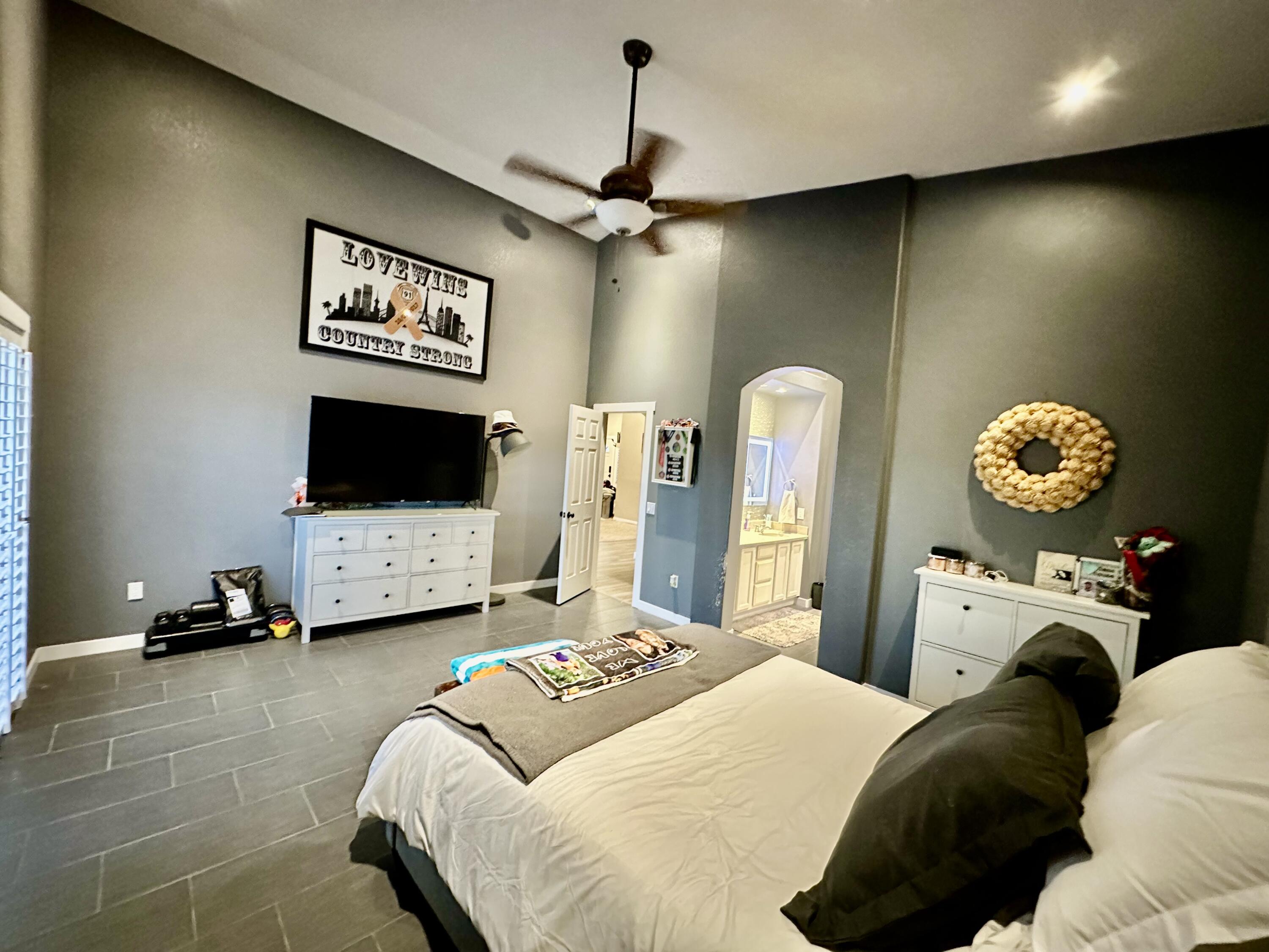 1461 Mesquite Road Blythe, CA 92225 - Photo 24 of 30 a bedroom with a bed and a flat screen tv