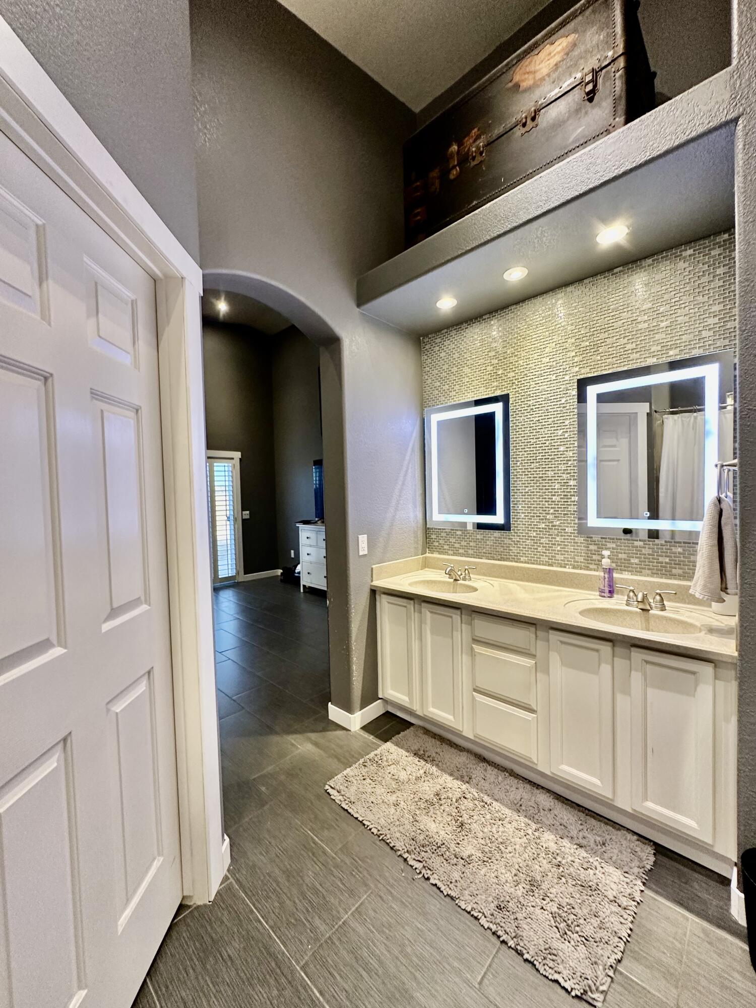 1461 Mesquite Road Blythe, CA 92225 - Photo 25 of 30 a large bathroom with a sink and a large mirror