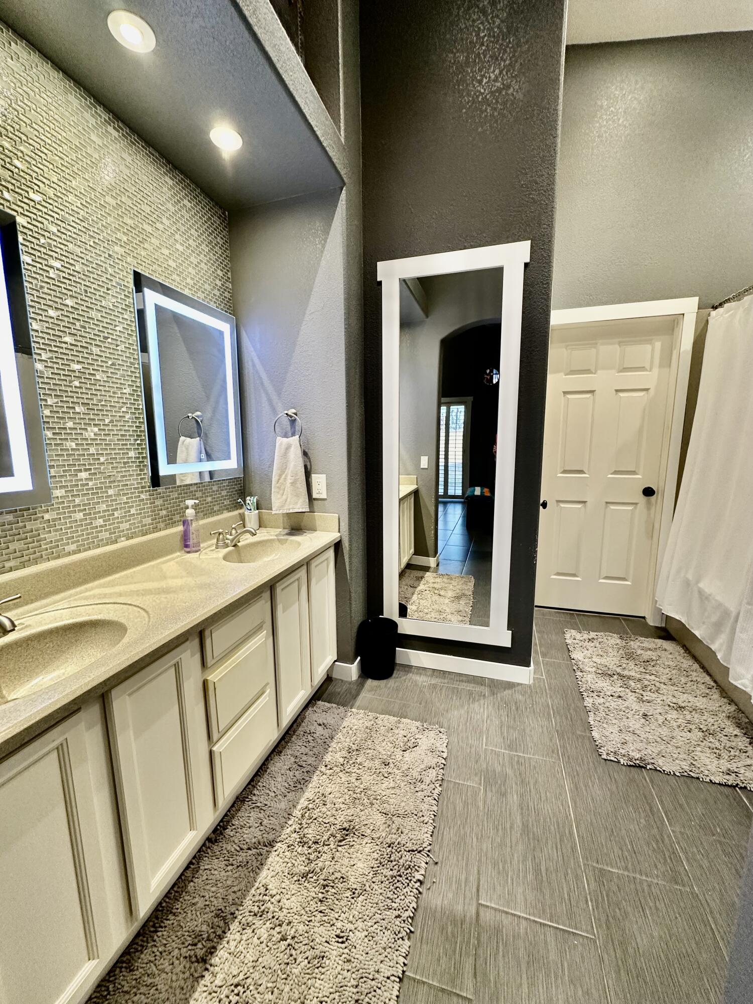1461 Mesquite Road Blythe, CA 92225 - Photo 27 of 30 a bathroom with a double vanity sink and a mirror