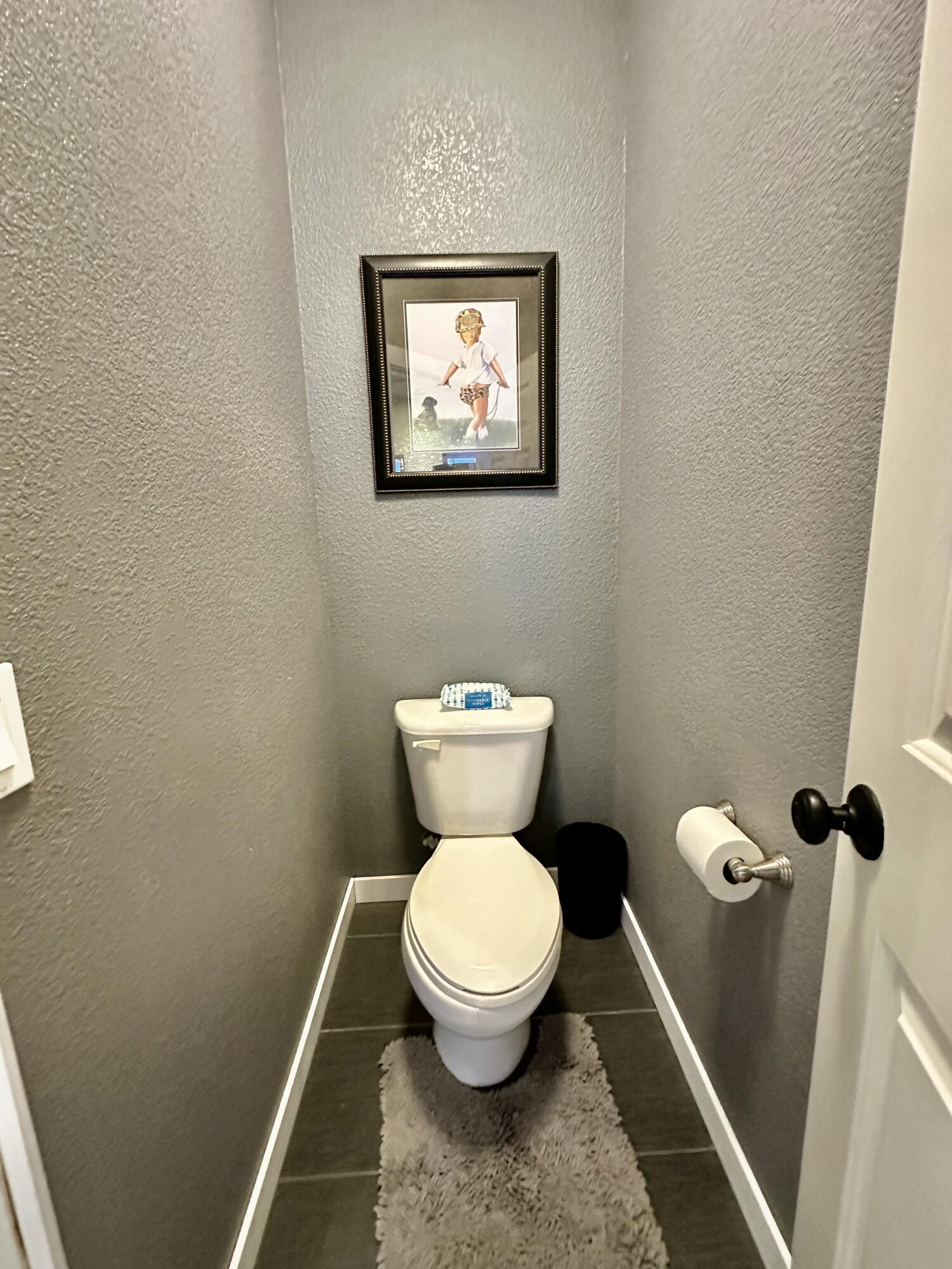 1461 Mesquite Road Blythe, CA 92225 - Photo 28 of 30 a bathroom with a toilet and a rug