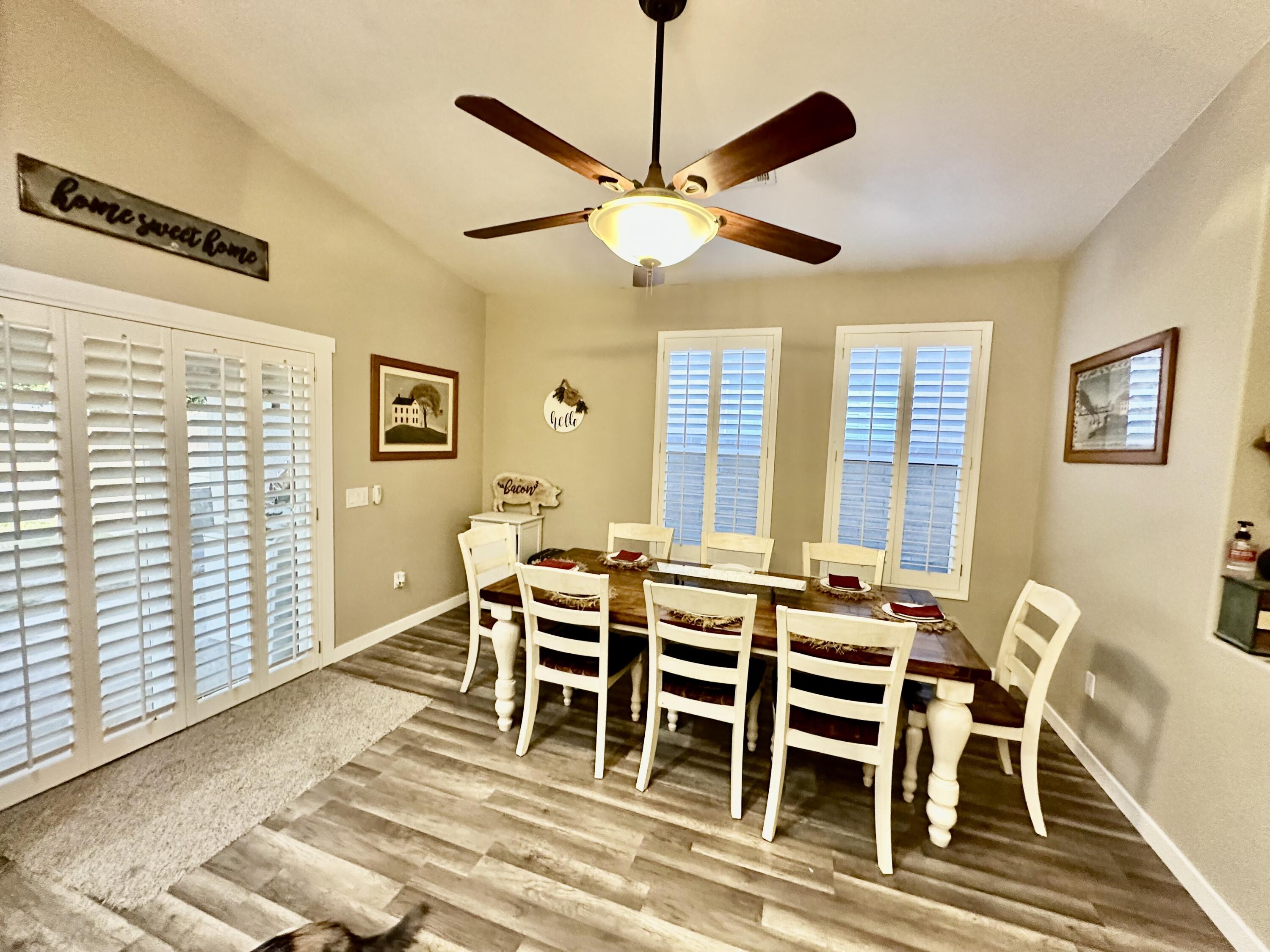 1461 Mesquite Road Blythe, CA 92225 - Photo 8 of 30 a view of a dining room with furniture and a window