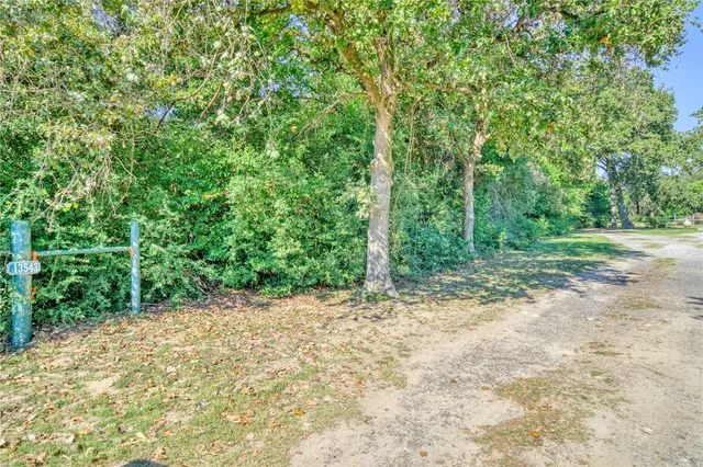 a view of a yard with an outdoor space