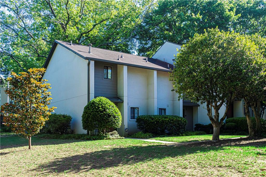 19 Finch Trail Northeast Atlanta, GA 30308 - Photo 2 of 28 a view of a house with a yard and large trees
