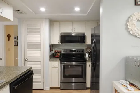 a kitchen with a stove and a microwave