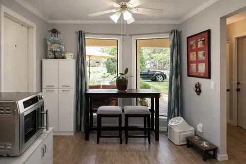 a view of a livingroom with furniture window and wooden floor