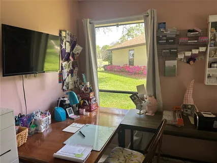 a room with furniture and a flat screen tv